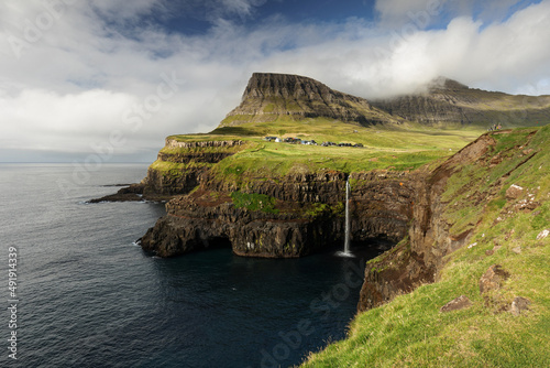 Faroe Islands, Denmark, Gasadalur and Mulafossur waterfall