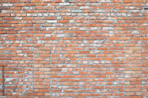 old brick wall made of aged red and white bricks. Vintage. Surface.Backdrop. Background.