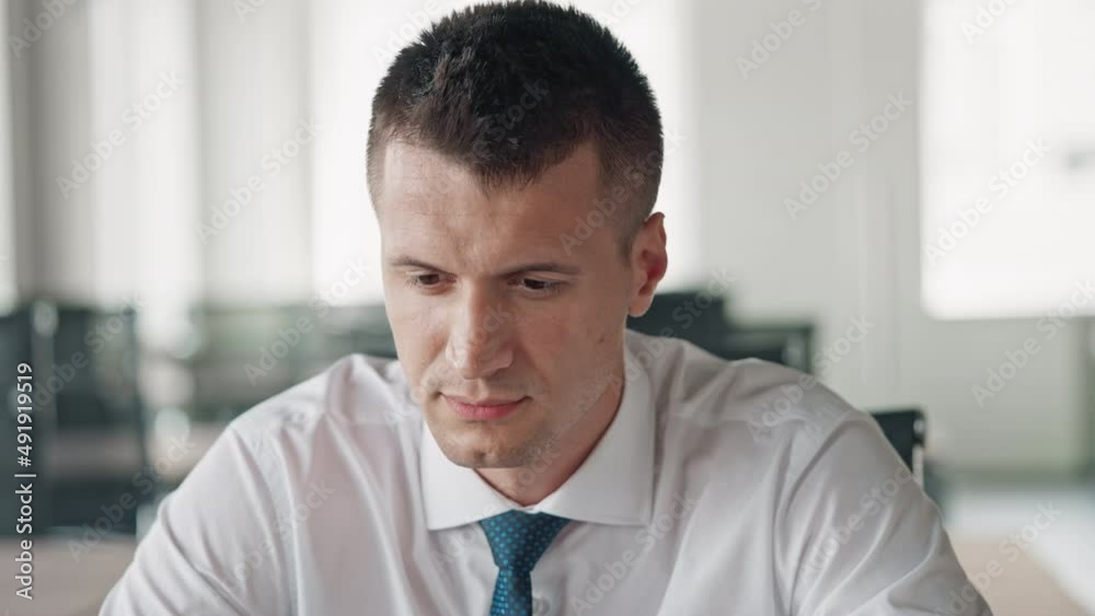 portrait reliable businessman wearing white shirt and tie looking camera friendly smiling sitting at workplace in office portrait reliable businessman wearing white shirt and tie looking camera friendly smiling sitting at workplace in office