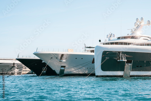 Super yachts moored in Monaco harbour on Monaco yacht show luxury lifestyle	
