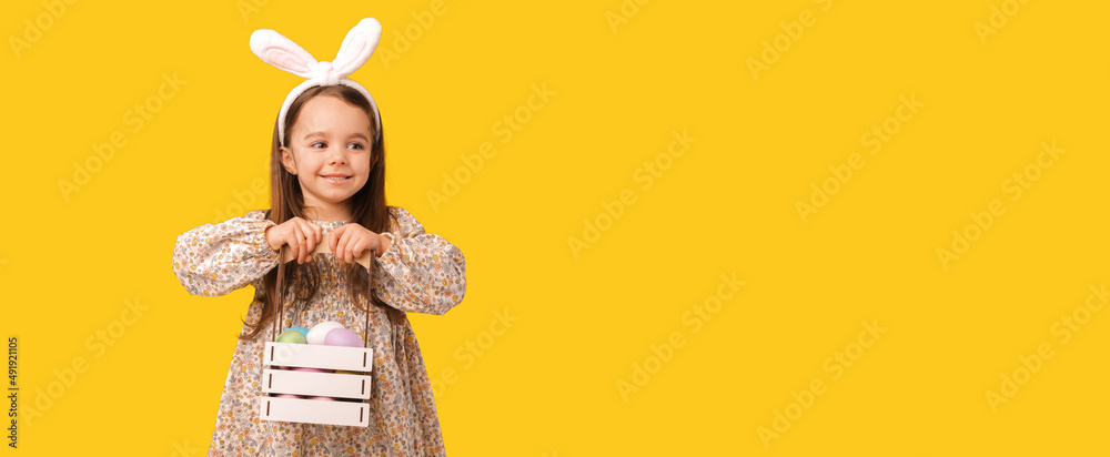 Close up banner photo of a cheerful girl holding a basket with easter eggs. Close up banner photo of a cheerful girl holding a basket with easter eggs.
