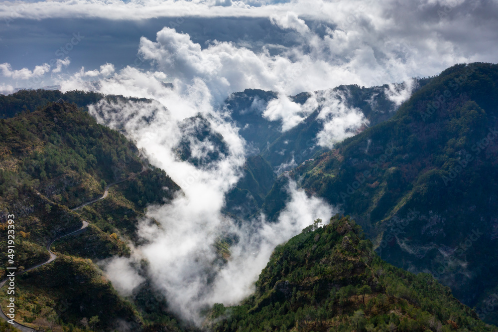 View into the valley of nuns in Madeira, Portugal. Mountains with dramatic clouds. 