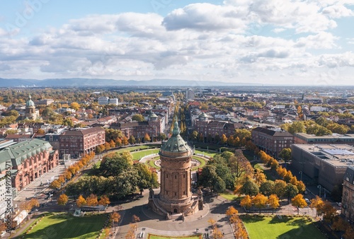 Autumn aerial cityscape of Mannheim city, Baden-Württemberg, Germany. Friedrichsplatz with the Mannheim Water Tower (Wasserturm) in the foreground 