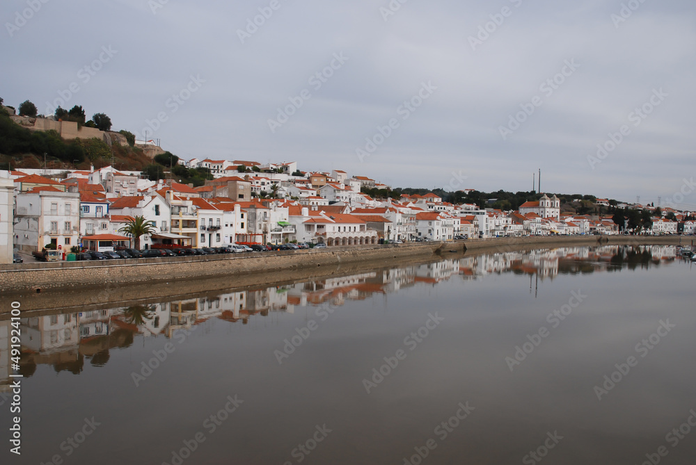 Alcácer do Sal panoramic view with reflection in the river