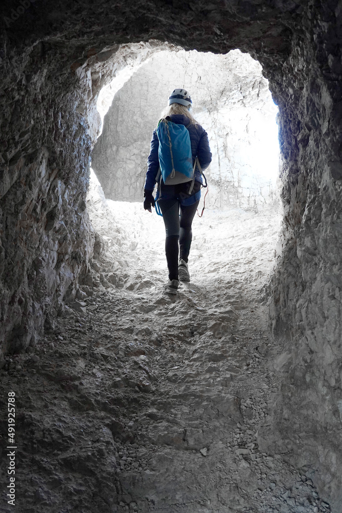Young woman on the via ferrata Innerkofler De Luca in Sexten Dolomites, South Tyrol, Italy, Europe