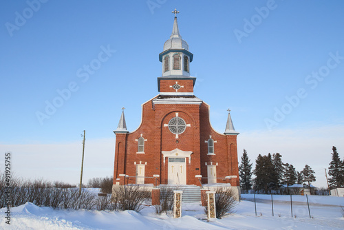 St. Norberts Roamn Catholic Church in a rural winter landscape photo