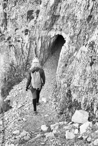 Young woman on the via ferrata Innerkofler De Luca in Sexten Dolomites, South Tyrol, Italy, Europe photo