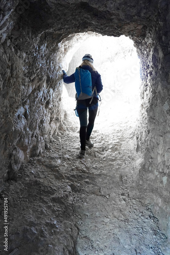 Young woman on the via ferrata Innerkofler De Luca in Sexten Dolomites, South Tyrol, Italy, Europe