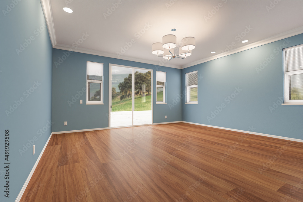 Newly Remodeled Room of House with Finished Wood Floors, Moulding, Blue Paint and Ceiling Lights. Newly Remodeled Room of House with Finished Wood Floors, Moulding, Blue Paint and Ceiling Lights.