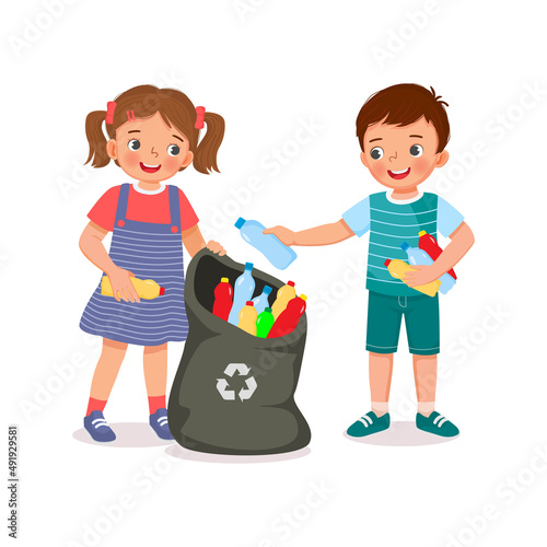 cute young child kids boy and girl collecting and picking up plastic bottles into garbage bag for recycling help to protect save environment
