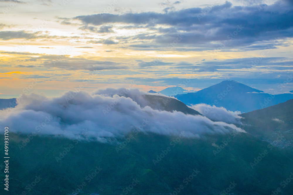 colorful sunrise at the highest peak of Mount Si Kunir, Mount Dieng, Wonosobo, Indonesia 