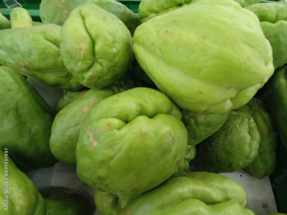 Fresh chayote for sale in the market Fresh chayote for sale in the market