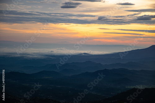 colorful sunrise at the highest peak of Mount Si Kunir, Mount Dieng, Wonosobo, Indonesia  © DODO HAWE