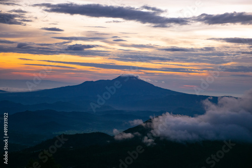colorful sunrise at the highest peak of Mount Si Kunir, Mount Dieng, Wonosobo, Indonesia 