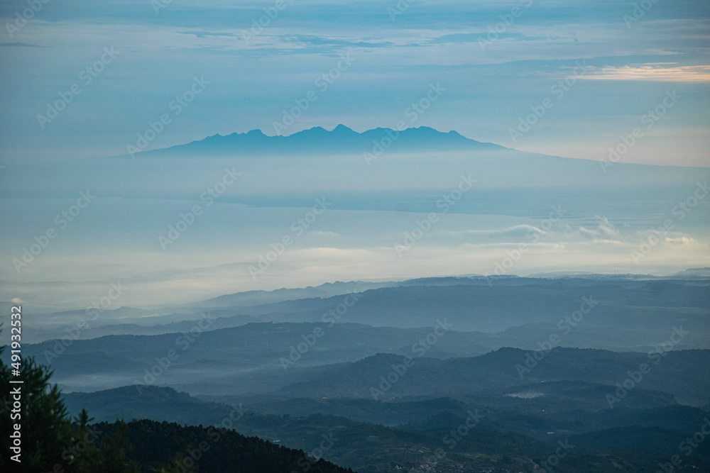 colorful sunrise at the highest peak of Mount Si Kunir, Mount Dieng, Wonosobo, Indonesia 