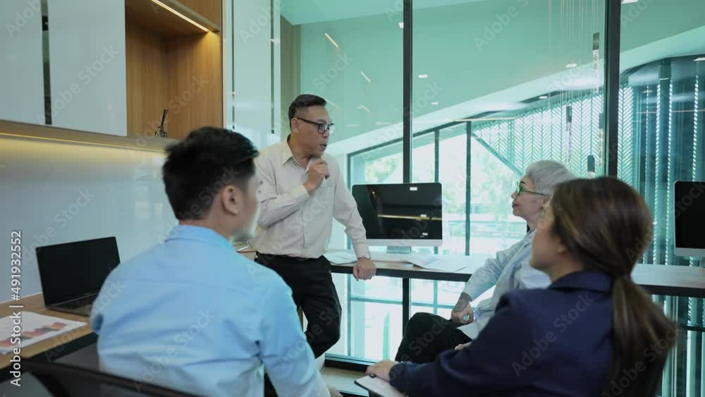 Business concept of 4k Resolution. Asian young business people group have discussion meeting in office. casual business plan. Business concept of 4k Resolution. Asian young business people group have discussion meeting in office. casual business plan.
