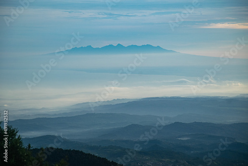 colorful sunrise at the highest peak of Mount Si Kunir, Mount Dieng, Wonosobo, Indonesia 