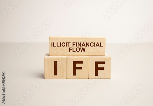 Fototapeta Naklejka Na Ścianę i Meble -  IFF illicit financial flows symbol. Concept words IFF illicit financial flows on blocks
