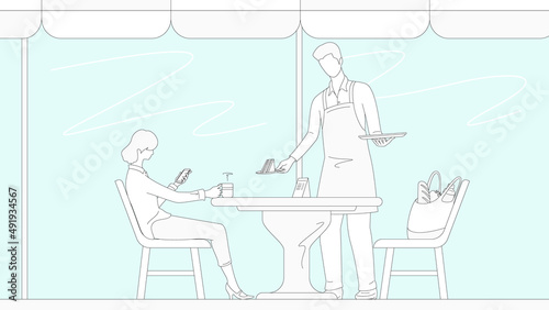 Young woman relaxing in cafe and waiter carrying a tray.