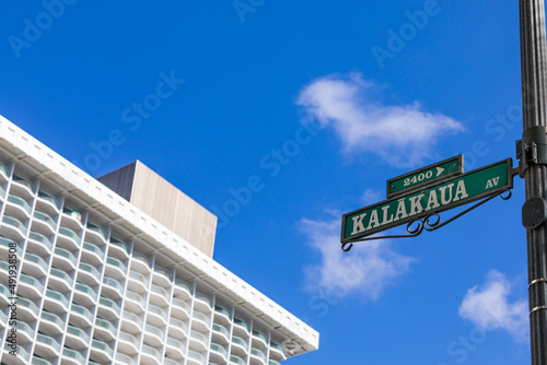 Kalakaua Avenue Road Sign in Waikiki, Hawaii, USA. Selective focus.