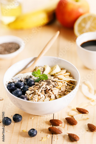 Healthy breakfast with yogurt  granola and fresh blueberries.