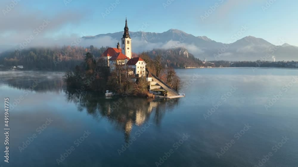 Lake Bled on a beautiful autumn morning. Sunrise in the hills after a misty night. Lake Bled on a beautiful autumn morning. Sunrise in the hills after a misty night.