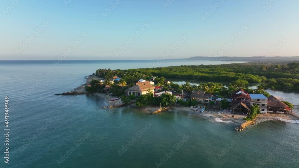 Rincon Del Mar, Colombia, Aerial View, Waterfront Houses of Old Fishing Village, Lagoon and Mangroves. Tropical Paradise Landscape - Drone Shot Rincon Del Mar, Colombia, Aerial View, Waterfront Houses of Old Fishing Village, Lagoon and Mangroves. Tropical Paradise Landscape - Drone Shot