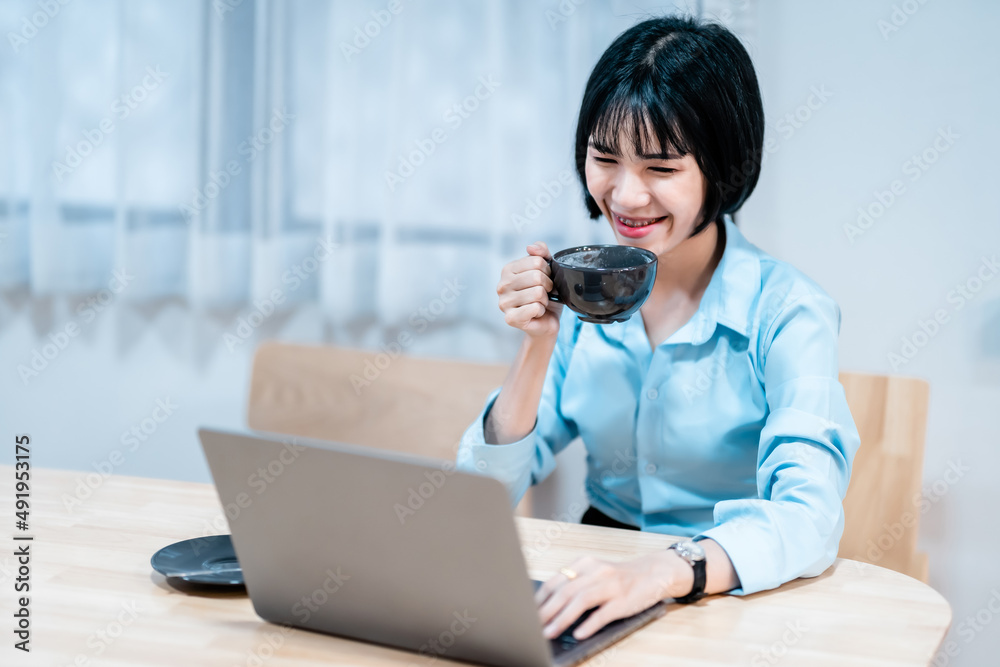 Smiling with dental braces asian freelance people businessfemale hold a coffee cup mug casual working with laptop computer with Notebook and smartphone in coffee shop,Business Lifestyle communication Smiling with dental braces asian freelance people businessfemale hold a coffee cup mug casual working with laptop computer with Notebook and smartphone in coffee shop,Business Lifestyle communication