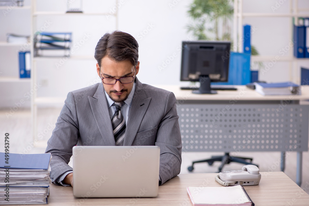 Young businessman employee working in the office Young businessman employee working in the office