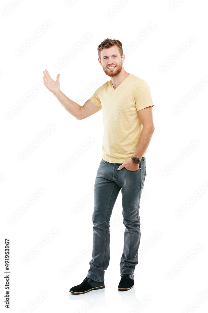 This is prime copyspace over here. Studio portrait of a young man pointing at blank copyspace while standing against a white background. This is prime copyspace over here. Studio portrait of a young man pointing at blank copyspace while standing against a white background.