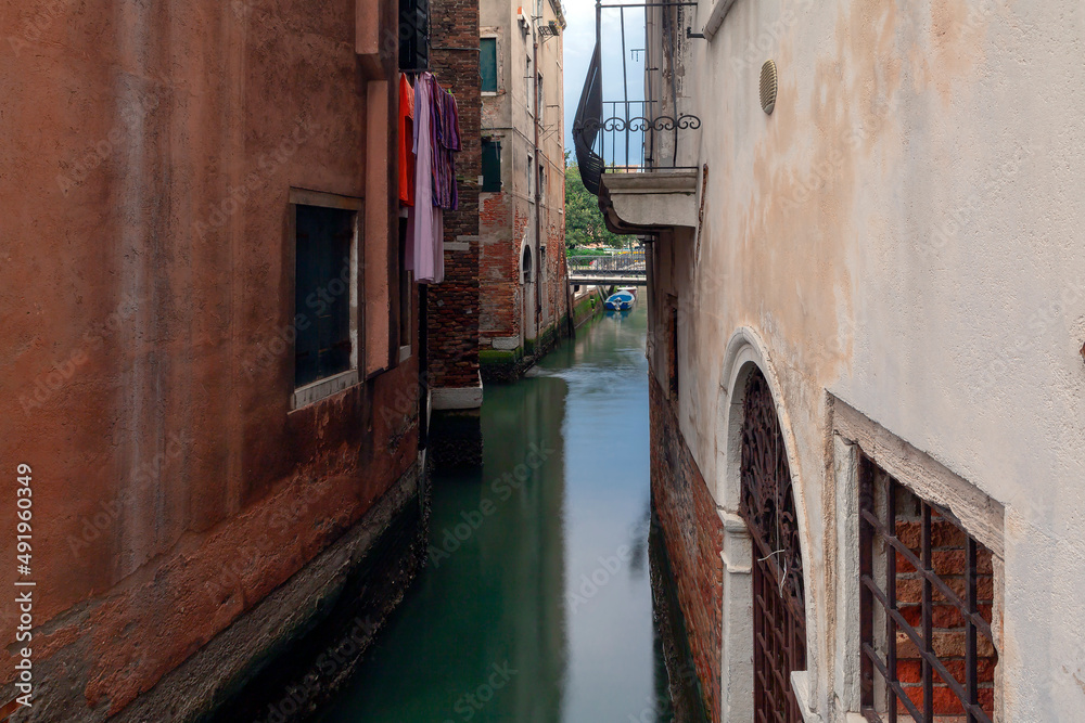 The canals of Venice are streets, and boats are transport.