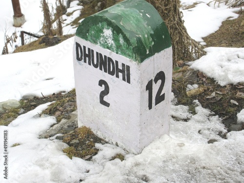 Dhundhi 2km ahead stone sign board Himachal Pradesh At a distance of 28 km from Manali Bus Stand and 15 km from Solang Valley photo