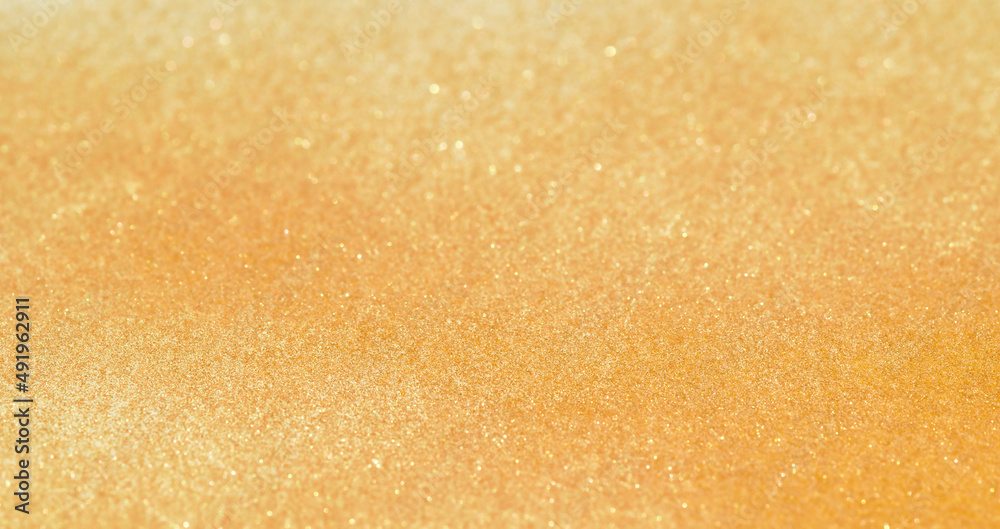 Obraz premium Light shining on gold metal panel, abstract texture background 