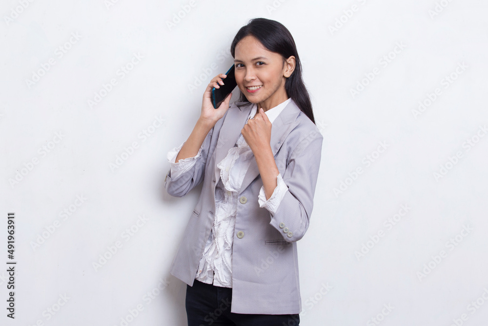 happy young asian business woman using mobile phone isolated on white background
happy young asian business woman using mobile phone isolated on white background
