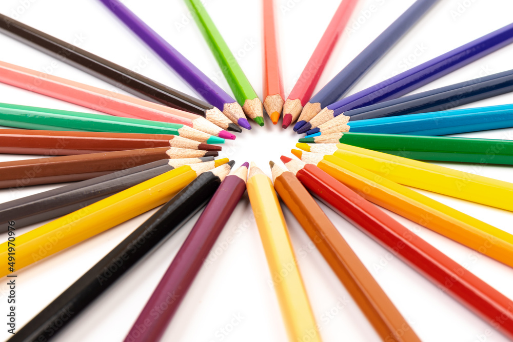 Many multicolored pencils, isolated on white background with copy space. Art and education background. Many multicolored pencils, isolated on white background with copy space. Art and education background.