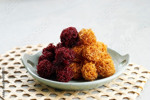 Grubi or Kremes Ubi, Indonesian Crispy Fried Snack Made from Sweet Potato photo