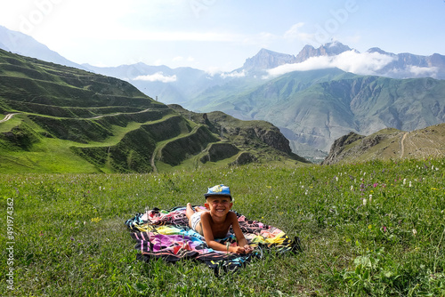 A boy in the gorge of the Cherek River in the vicinity of the Gymyhli tract. Caucasus June 2021 photo