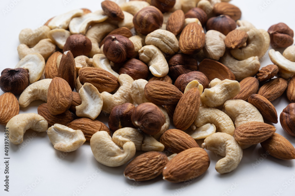 Various nuts on a white background close-up. Various nuts on a white background close-up.