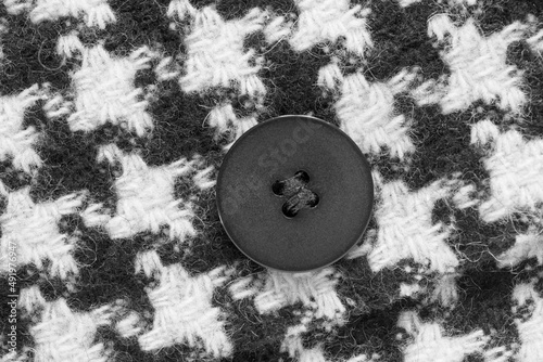 Button sewn on fabric