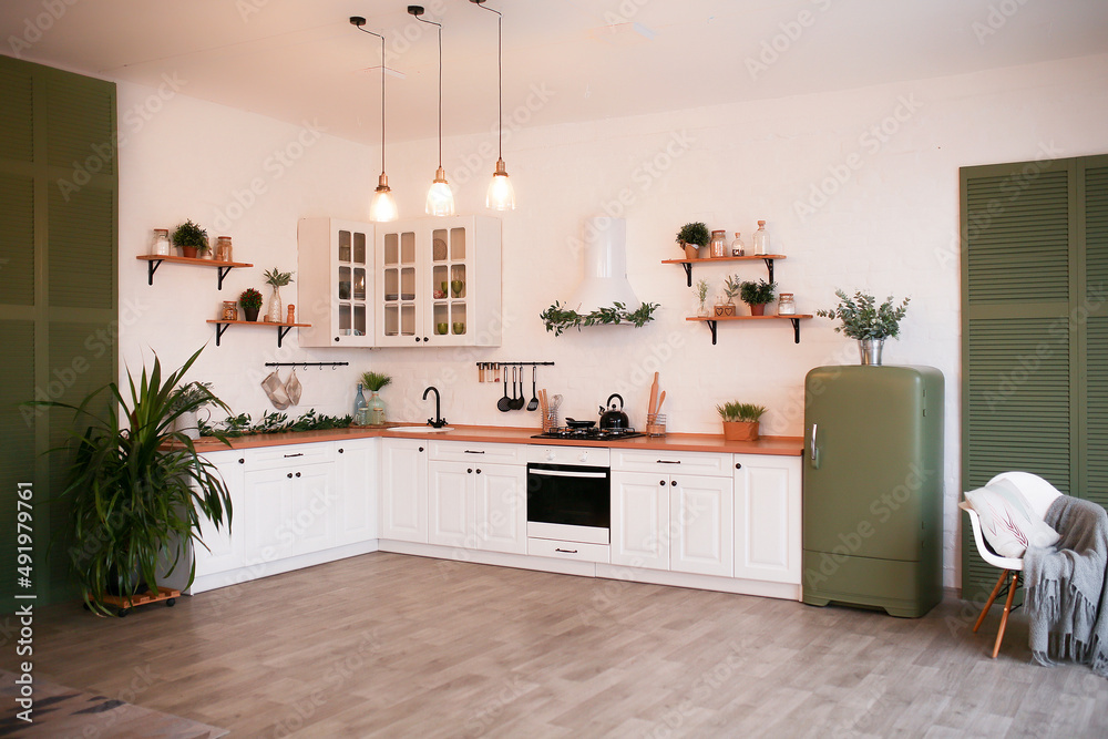 Modern Kitchen Interior with Island, Sink, Cabinets, and Big Window in New Luxury Home.