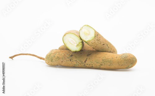 fresh sour fruit tamarind slices isolate on white background photo