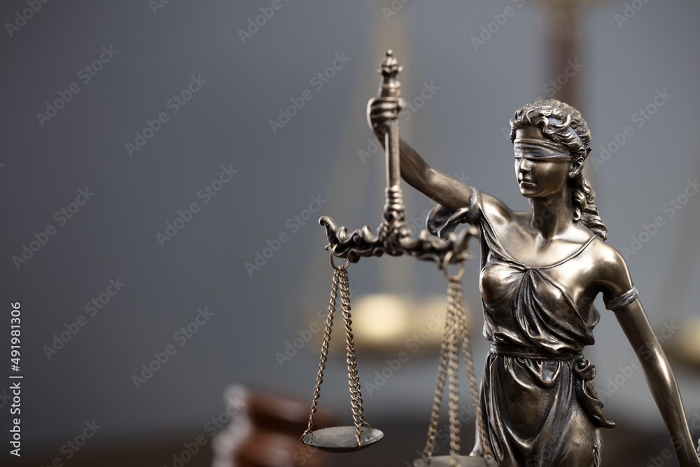 Law and justice concept. War crimes. Gavel, Themis sculpture and scale in lawyers office. Gray background. - obrazy, fototapety, plakaty 