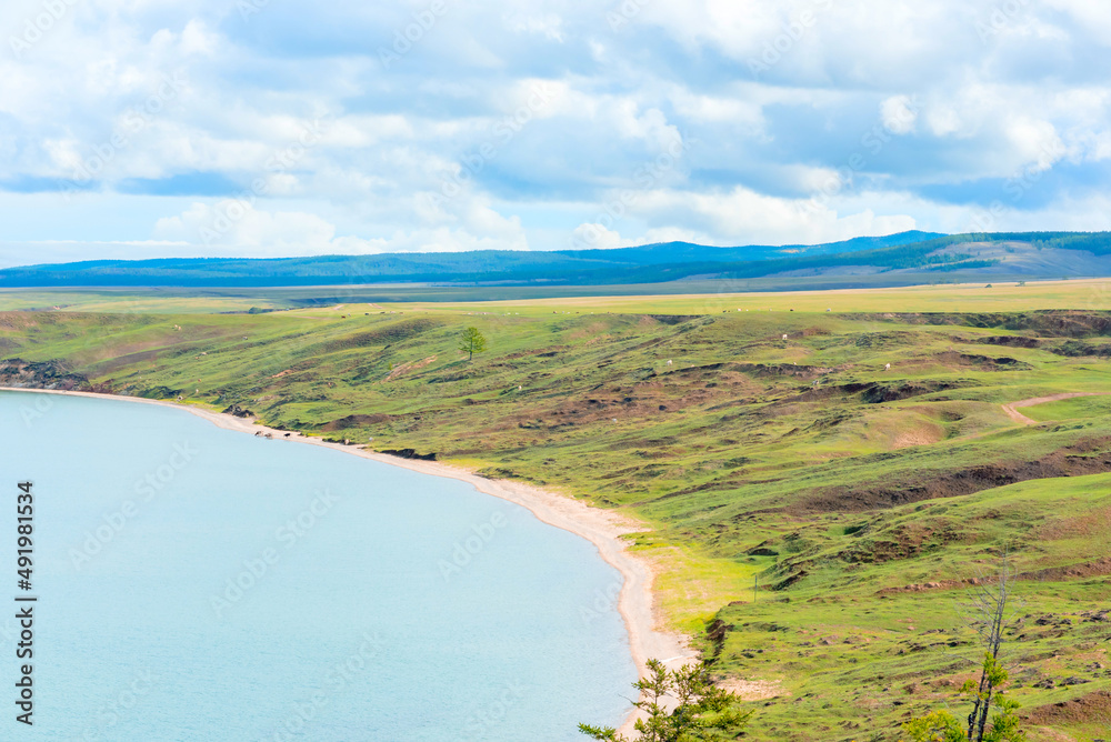 Lake Baikal at sunny summer day. Beauty of nature concept. Soft focus Lake Baikal at sunny summer day. Beauty of nature concept. Soft focus