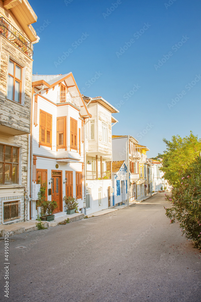 Streetscape with old historical colorful houses on a summer day in the old town. Princes' Islands, Turkey