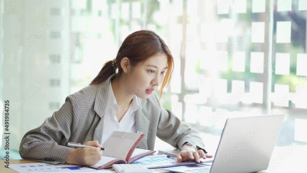 Business woman using calculator for do math finance on wooden desk in office and business working background, tax, accounting, statistics and analytic research concept. Business woman using calculator for do math finance on wooden desk in office and business working background, tax, accounting, statistics and analytic research concept.