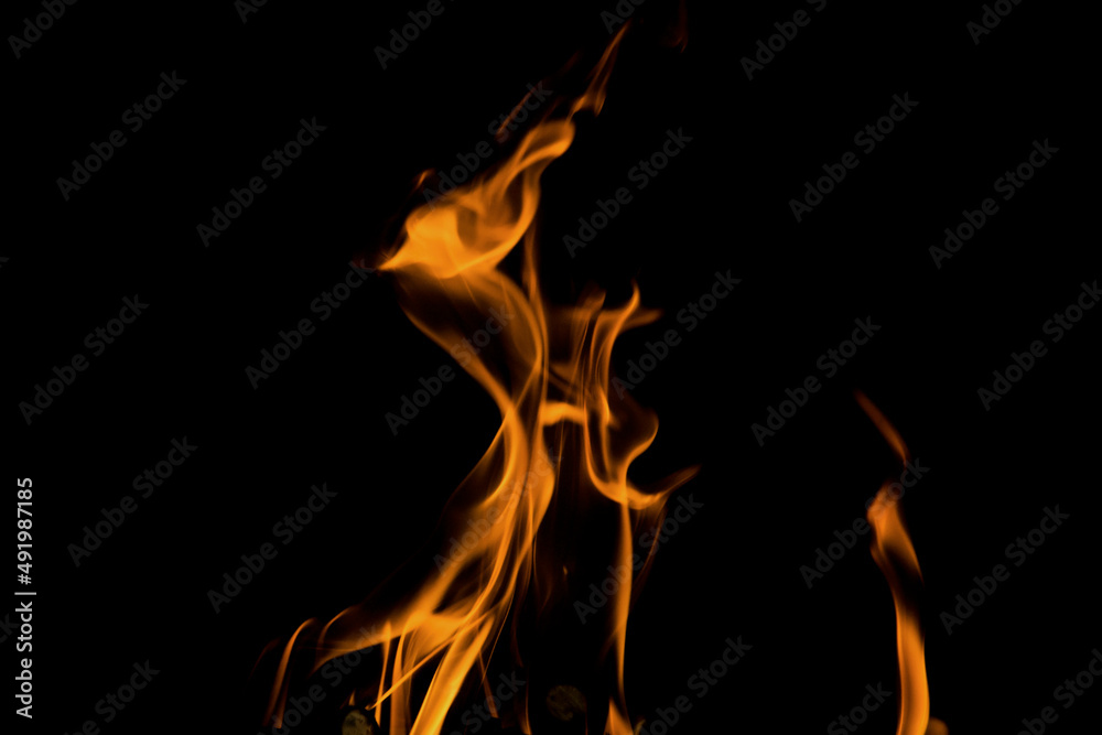 Fototapeta premium Close up burning flames on black background for graphic design or wallpaper