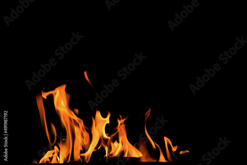 Close up burning flames on black background for graphic design or wallpaper © Nattawut