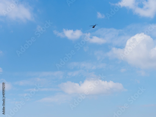 青空を飛ぶヘリコプター photo