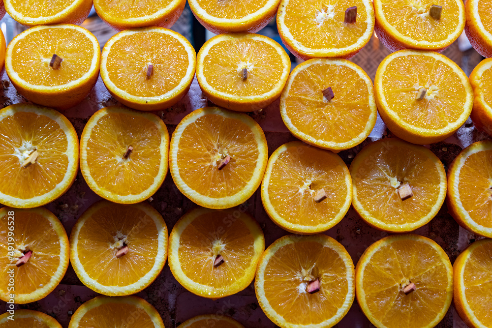 Massed juicy oranges displayed on market stall Massed juicy oranges displayed on market stall
