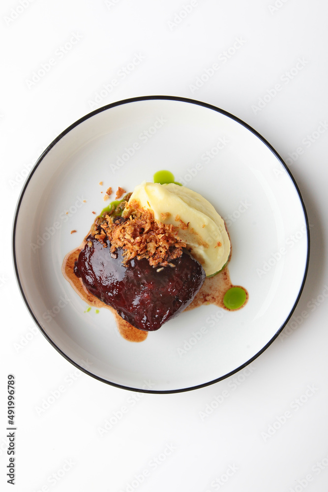 Beef cheeks with mashed potatoes. Hearty food. Meat food. Photo on a white background for the menu.Vertical photo.Flat lay.Top view.Copy space.Isolated object.Flat lay. Beef cheeks with mashed potatoes. Hearty food. Meat food. Photo on a white background for the menu.Vertical photo.Flat lay.Top view.Copy space.Isolated object.Flat lay.